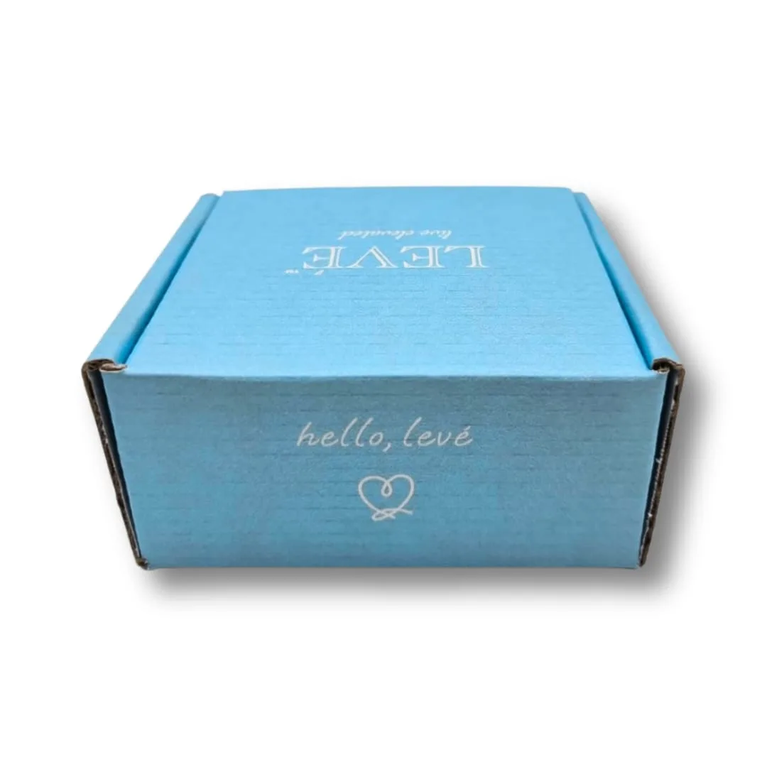 Blue custom printed corrugated mailer box with a printed inside lid