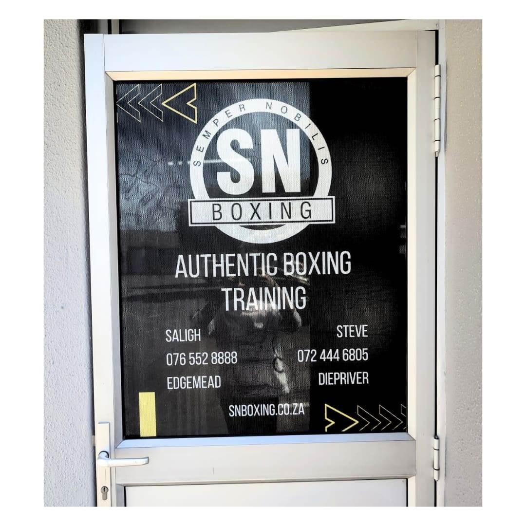Glass entrance door branded with printed Contravision window graphics