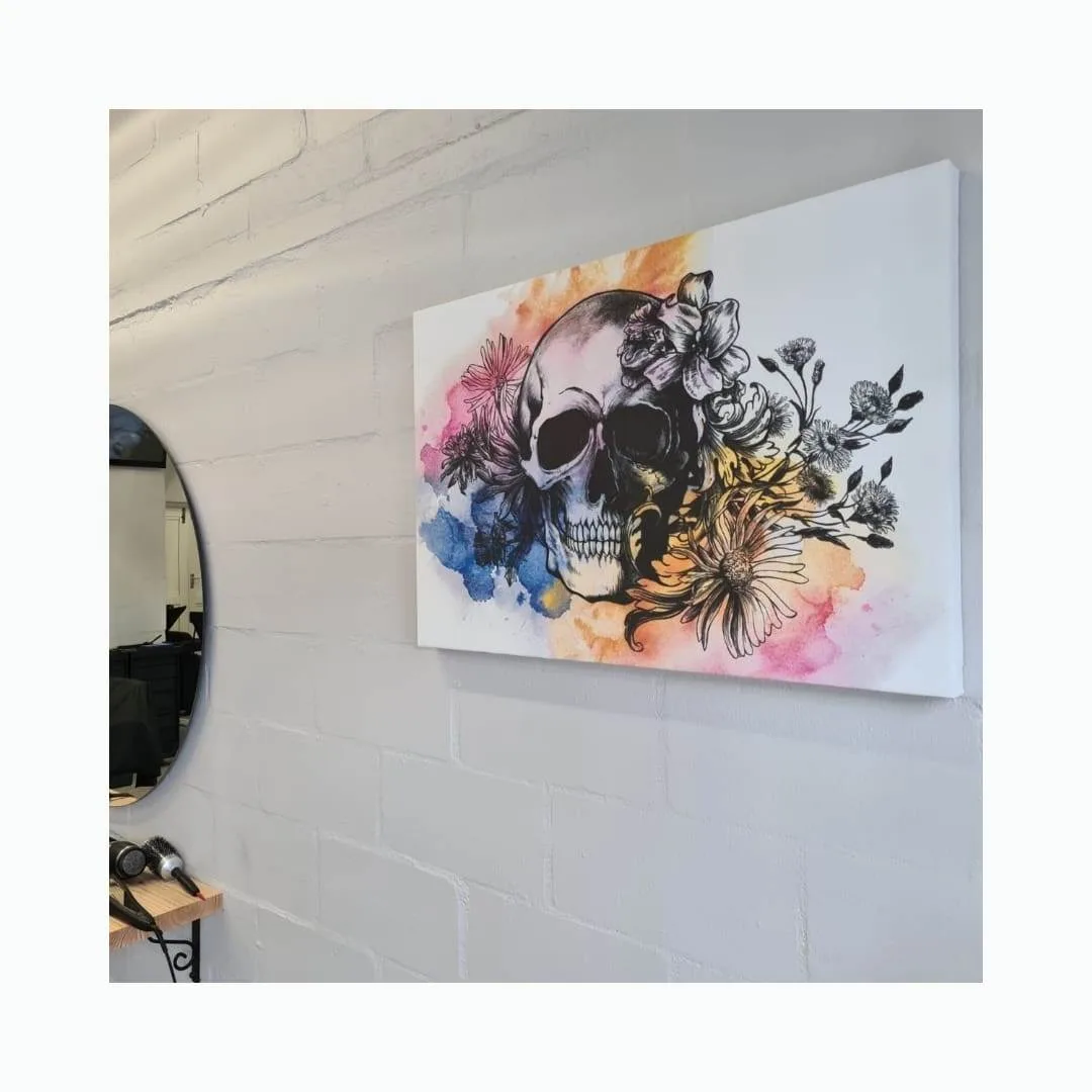 Colourful art canvas print hanging on a white brick salon wall
