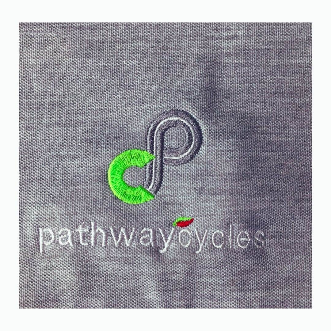 Close up of an embroidered logo on a melange golf shirt