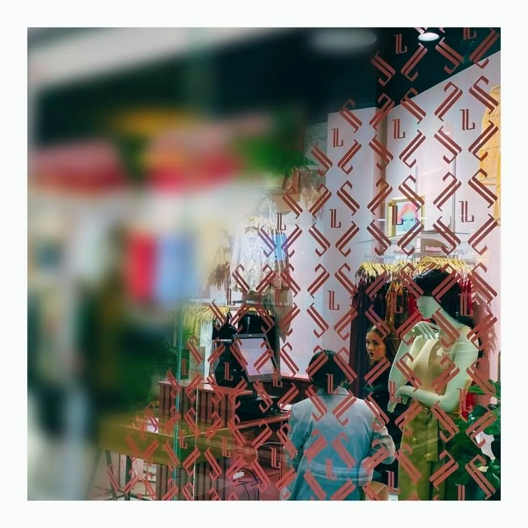 Retail shopfront window decorated with a custom vinyl decal