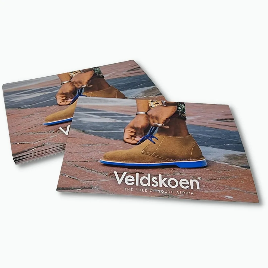 Full colour printed brand postcards in a stack