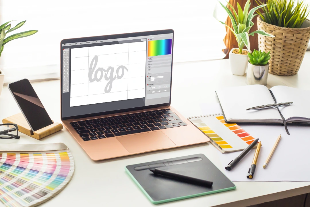 Professional graphic design studio workspace for print collateral