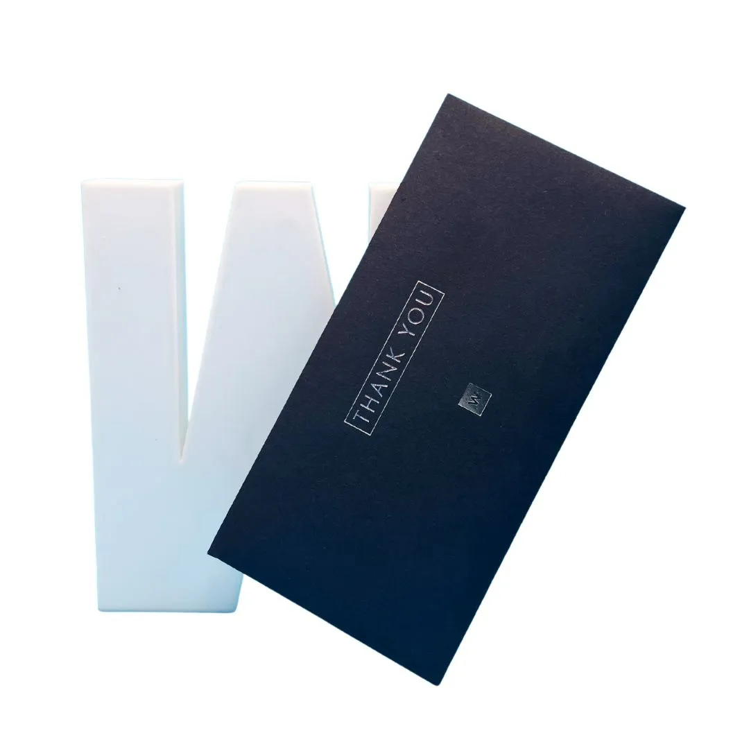 DL sized printed thank you voucher on dark card