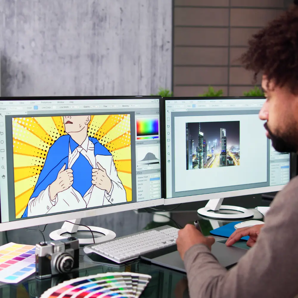 Pre-press graphic designer manually reviewing a digital layout proof on a computer screen for print quality control.