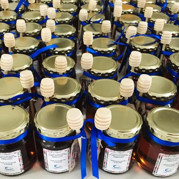 Custom printed product labels on honey jars