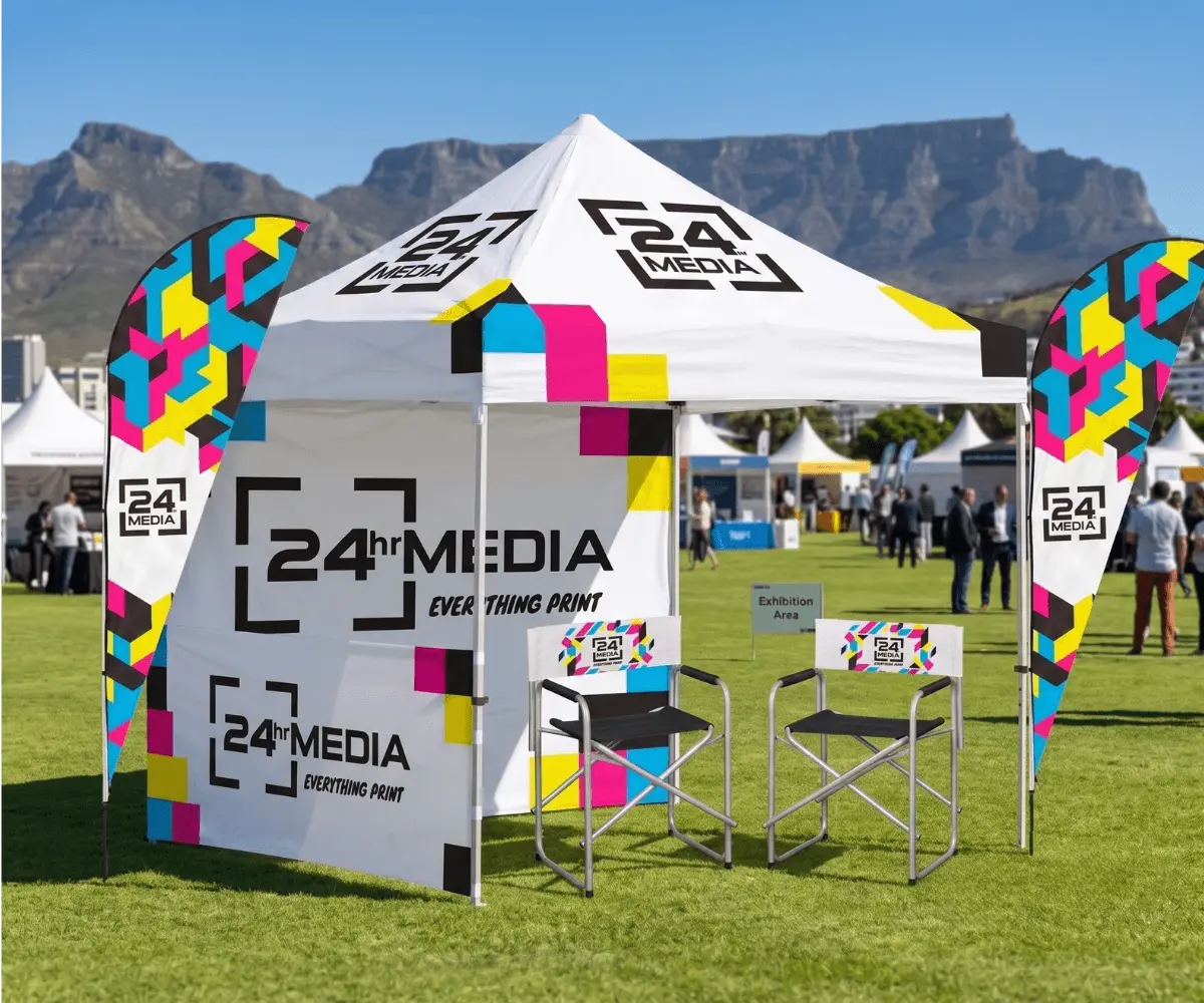 Custom branded outdoor event setup in Cape Town featuring a gazebo, shark fin banners, and directors chairs